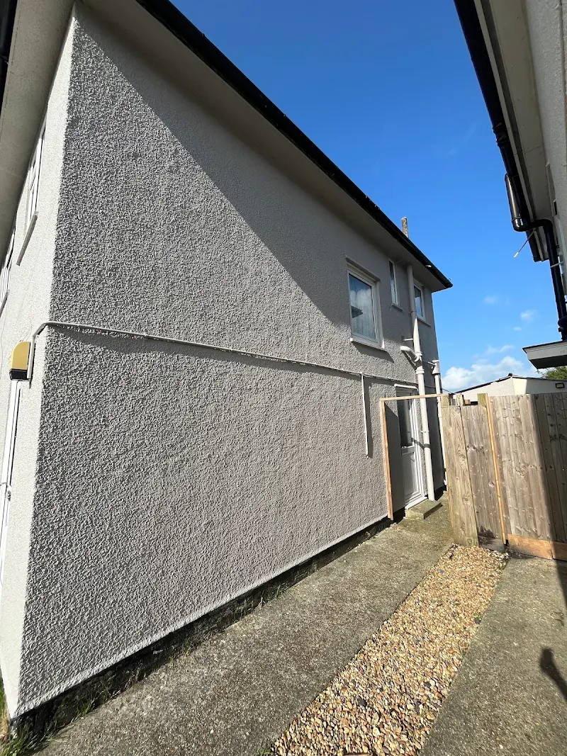 Exterior render painting, side of property