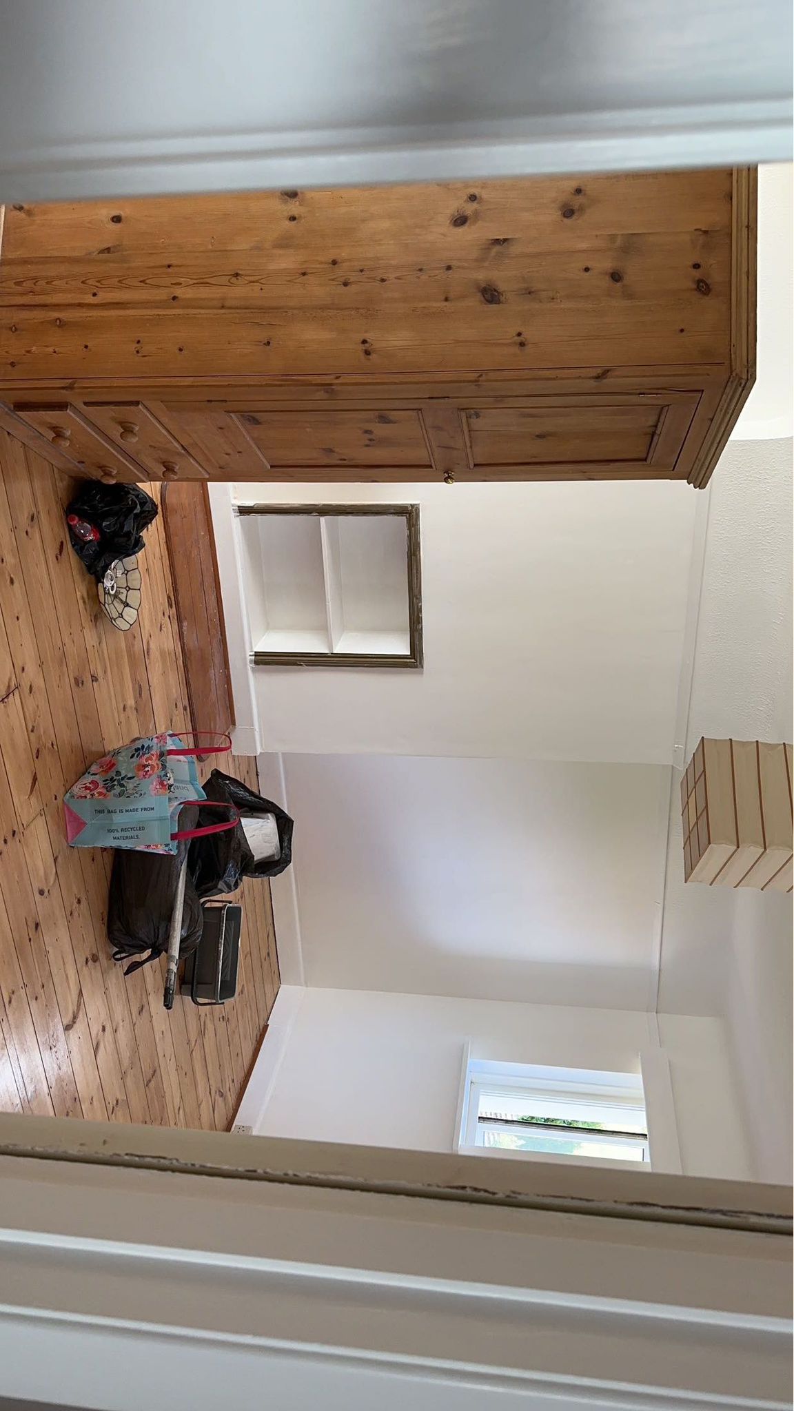 Refinished wood flooring with period fireplace surround